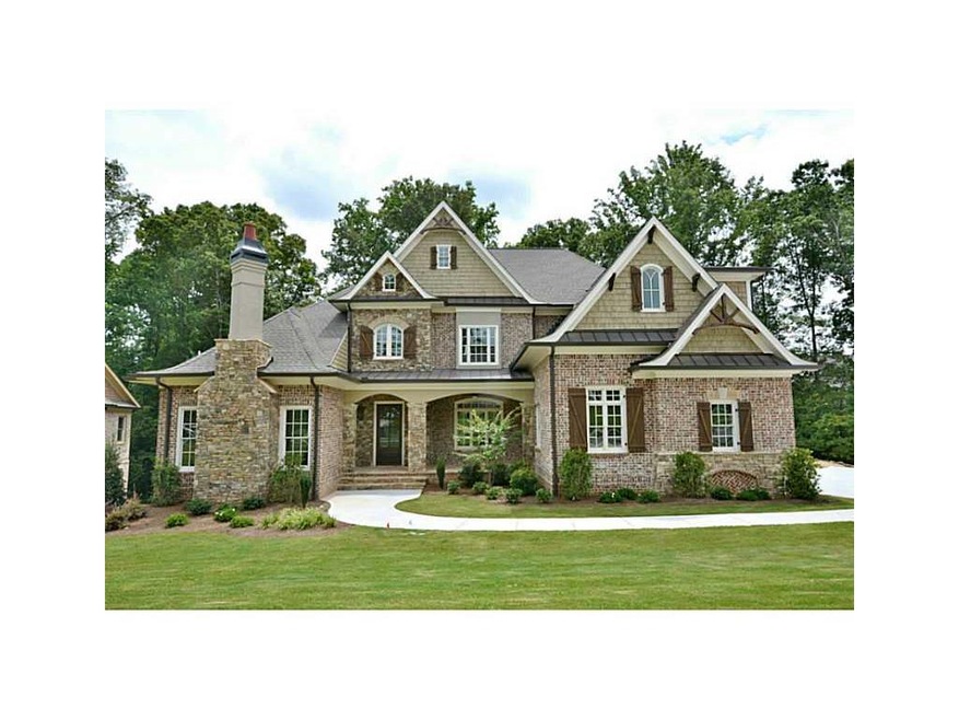 Exterior Front. A stately combination of brick, st