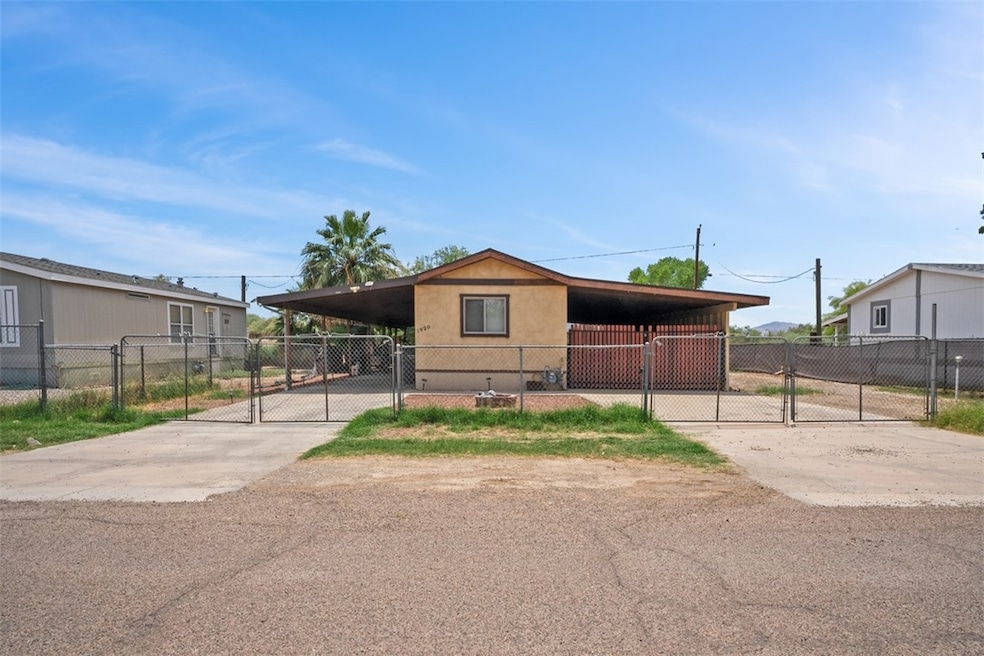 Manufactured / mobile home with a gate, driveway,