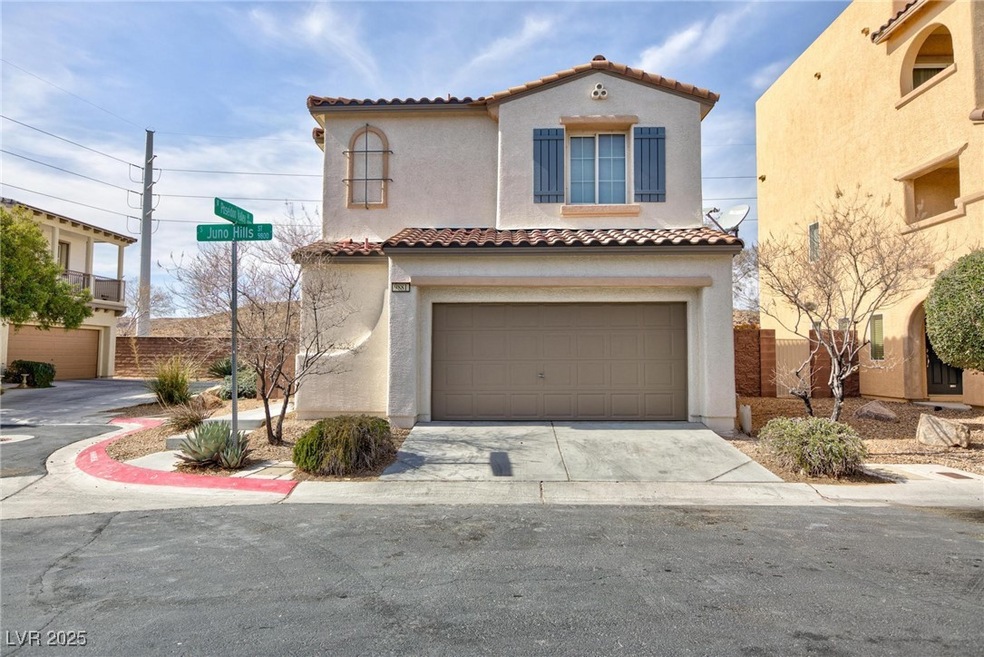 Mediterranean / spanish home featuring a garage