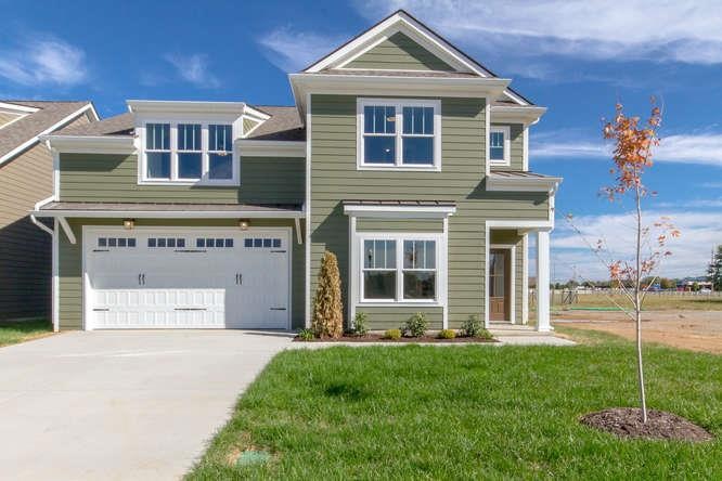 Front view of home. 4 bed with two bedrooms and two full baths down! Hardie Board (Fiber Cement) exterior! 