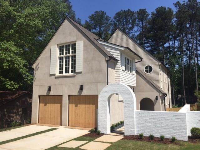 Hard coat stucco and cedar shingle exterior with p