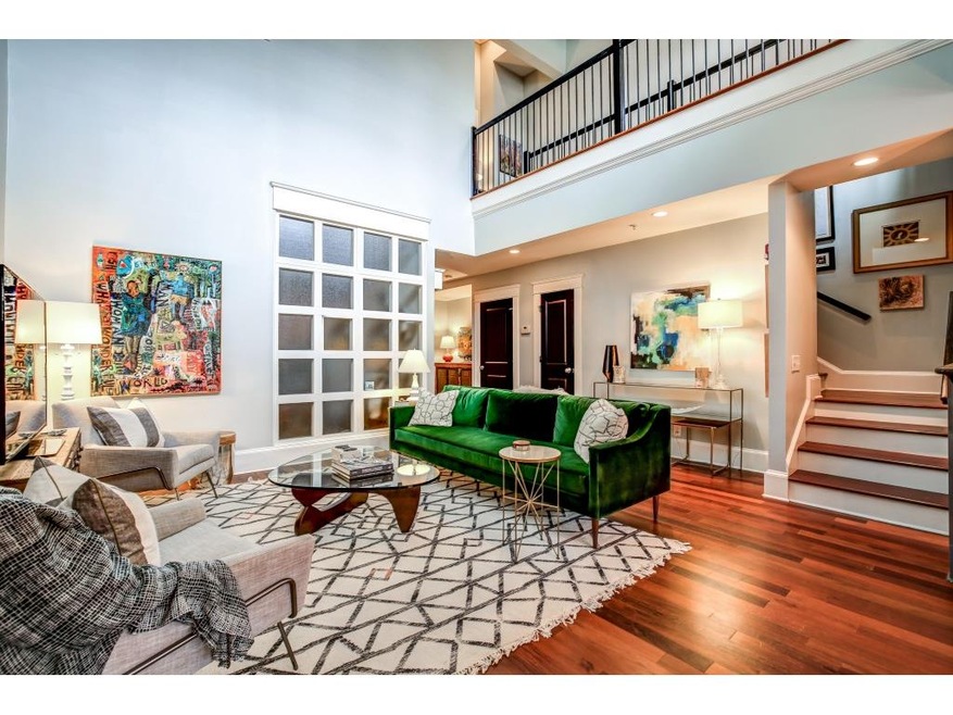 Brilliantly lit Great Room view up to the second floor. Cherry hardwood floors and tall ceiling allow for tons of space.