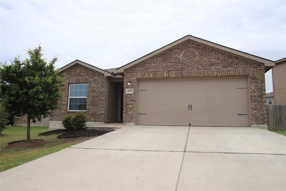 Ranch-style house with brick siding, driveway, an