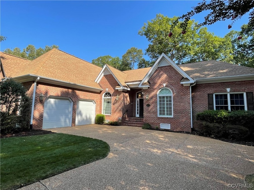 View of front of house with garage and a front lawn