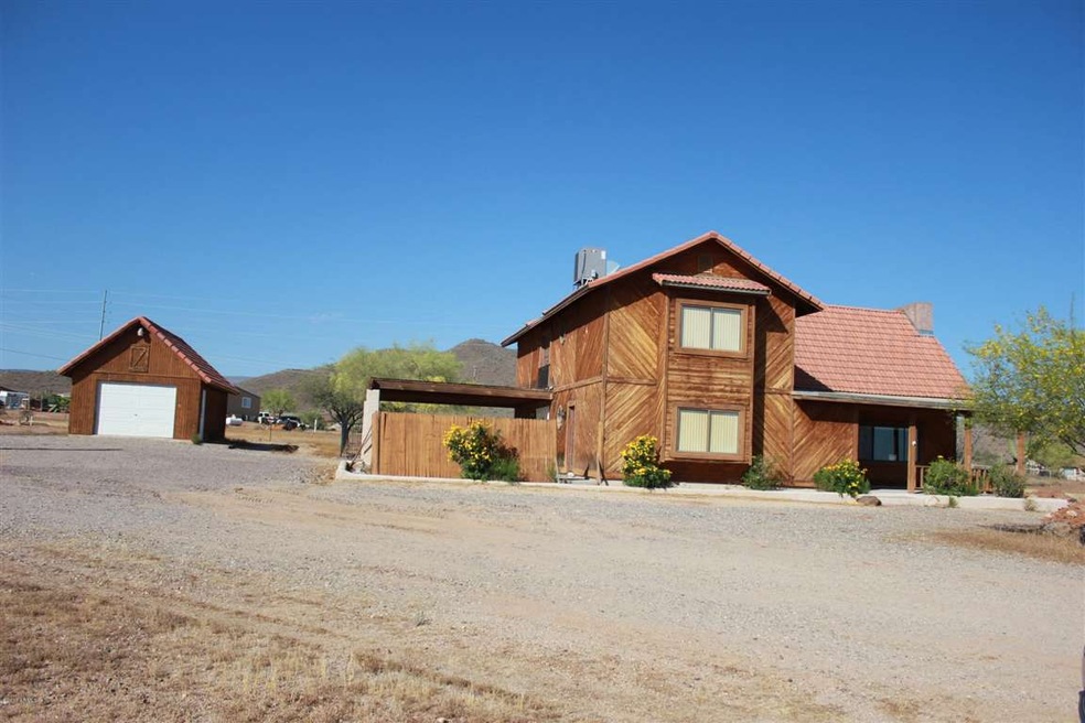 Front elevation w/ detached garage