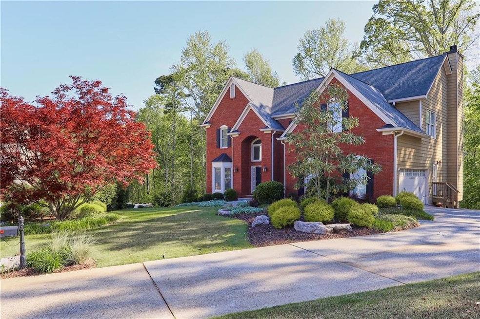 Traditional-style home with brick siding, driveway