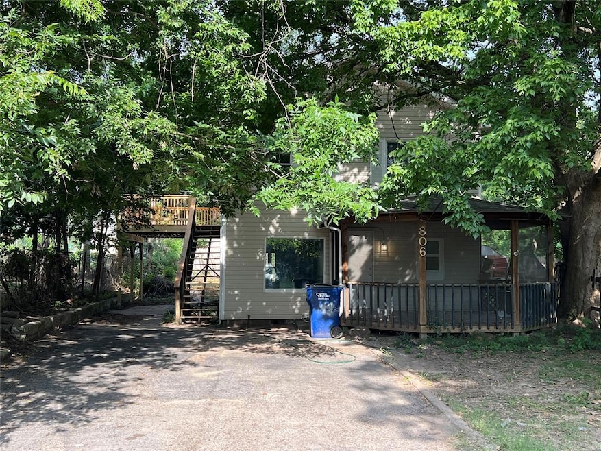 Rear view of property with a wooden deck