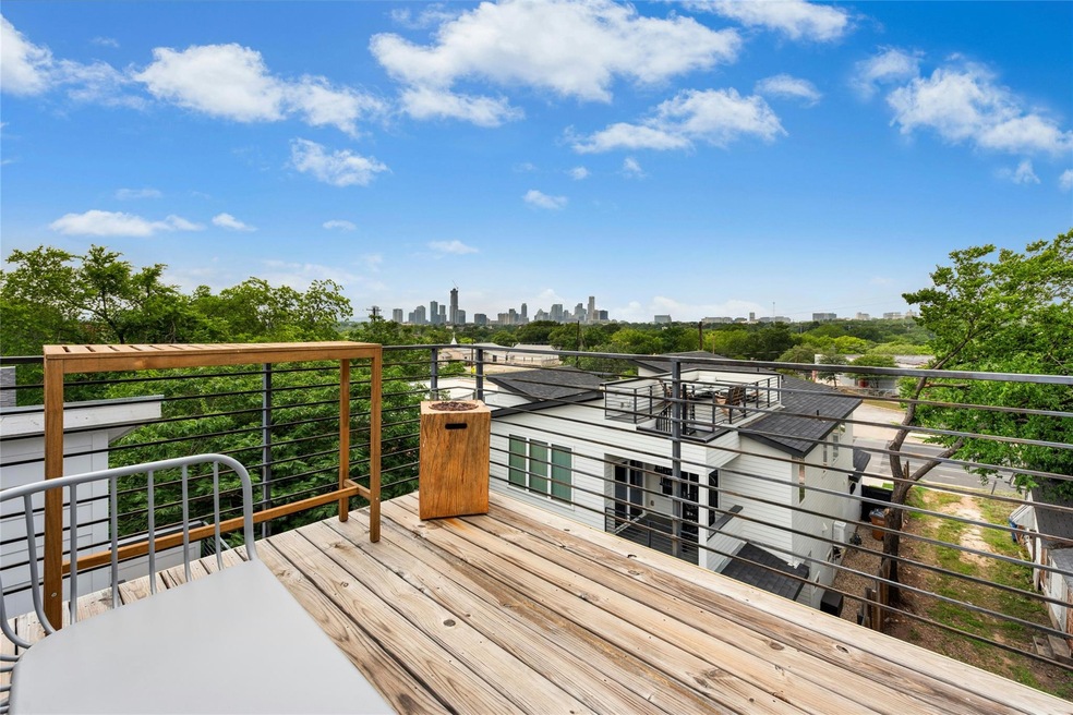 Wooden deck featuring a city view