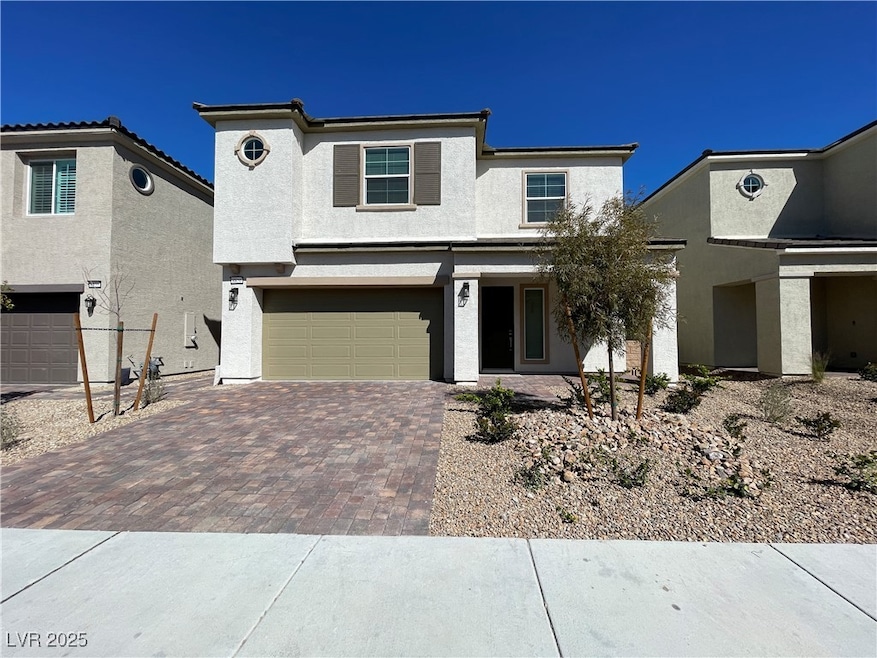 View of front facade with stucco siding, decorativ