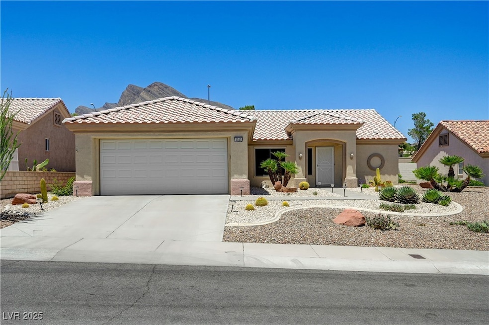View of front of property featuring an attached ga