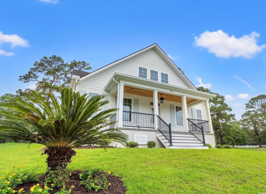 Bungalow with a porch, stairway, a front yard, and ceiling fan