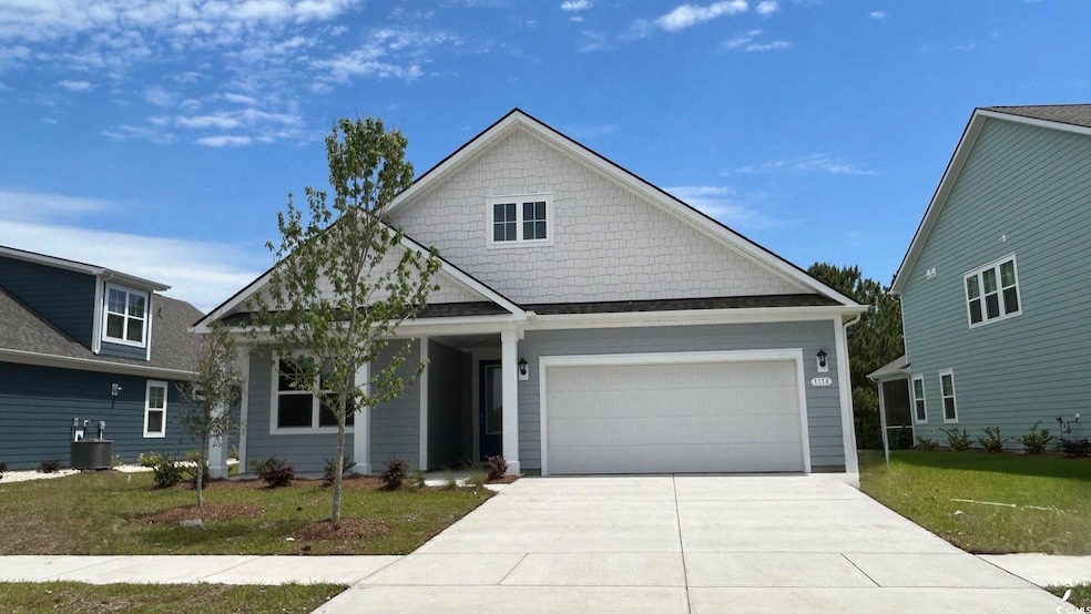 View of front of property featuring an attached ga