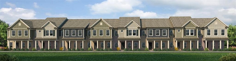 View of front of house with board and batten siding, a shingled roof, and a front yard