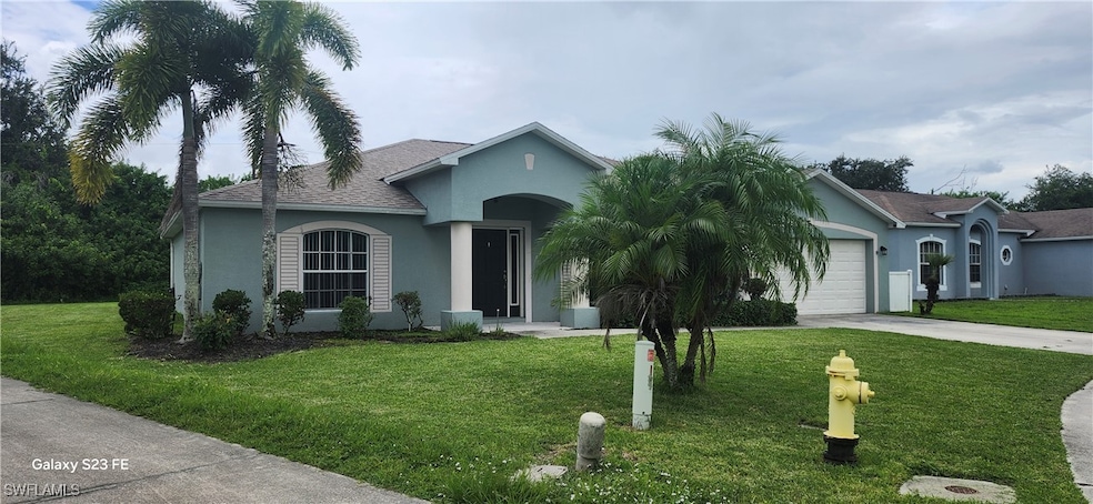Single story home featuring stucco siding, drivewa