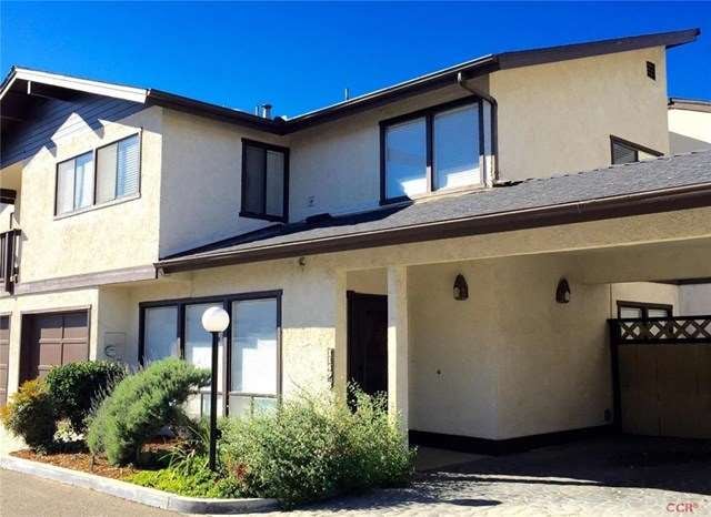 Front exterior - parking  is via garage at left an