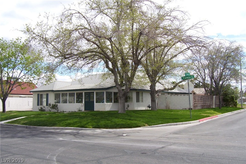 Corner lot with beautiful lawns and shady trees!