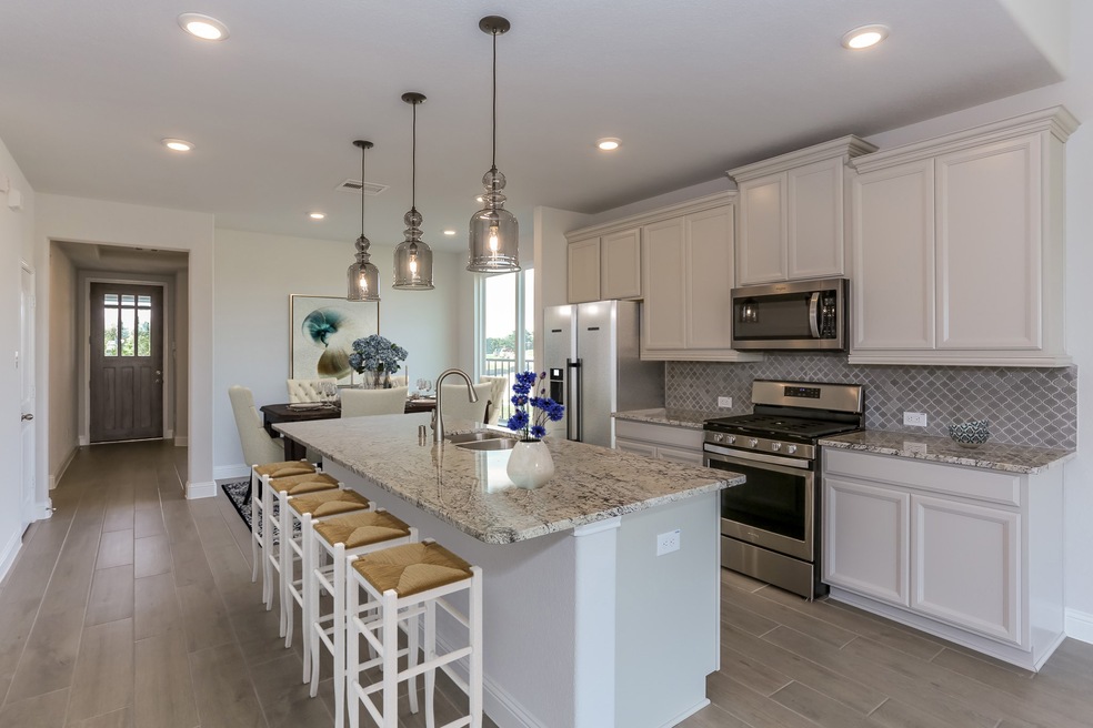 **Home is Under Construction. The photo shown here is of a completed home that has the same floor plan and similar elevation. Options and color selections may vary.**