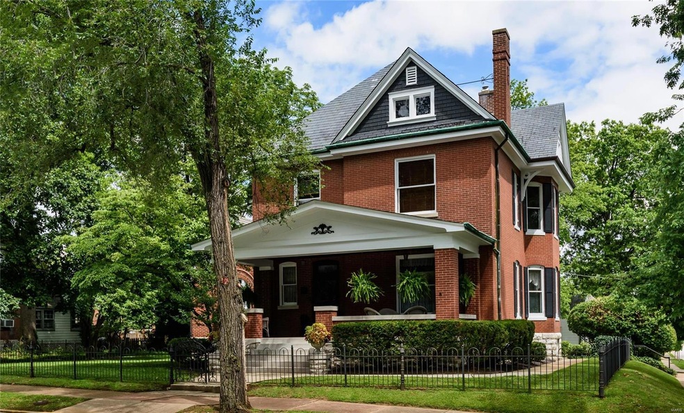 Period fencing adds to the stately curb appeal