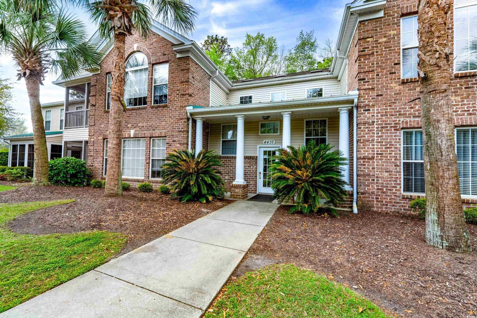 View of front of home featuring brick siding