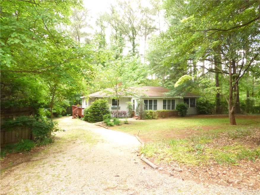 Large wooded lot filled with spring flowers. Priva