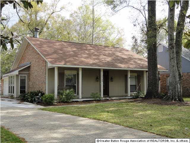 Beautiful Acadian home with raised wood front porc