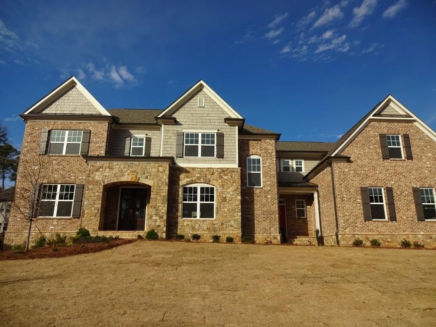 The Carson on homesite 6 has a brick, stone and sh