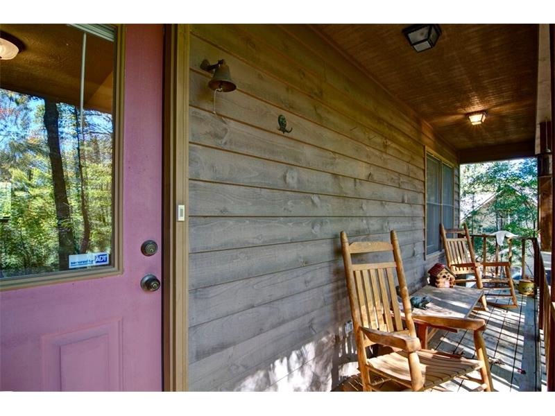 Rocking chair front porch invites you to sit a whi
