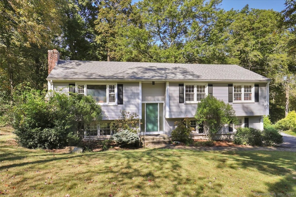 Sweeping lawn with generous set-back from road for privacy