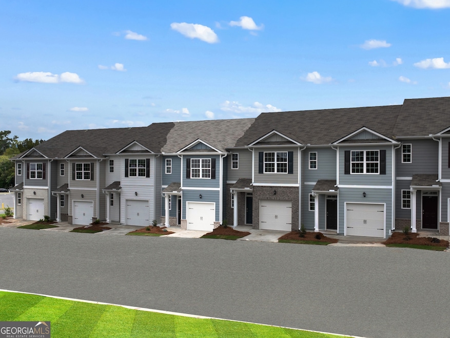 Pearson townhome exterior with blue color vinyl an
