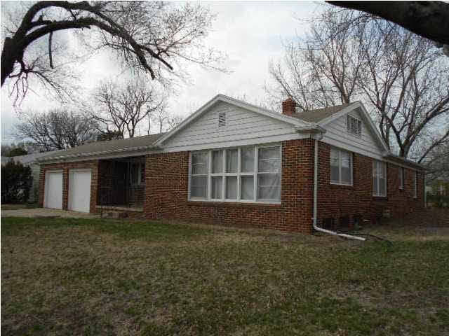 FRONT AND EAST SIDE OF THIS GOOD HOME