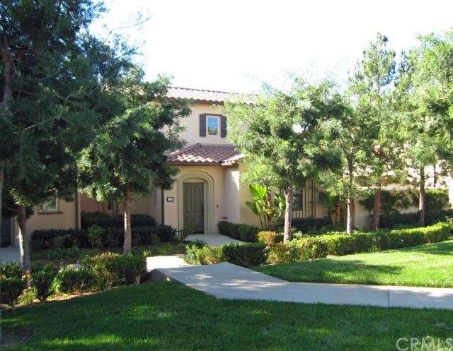 Beautifully landscaped front entrance maintained b