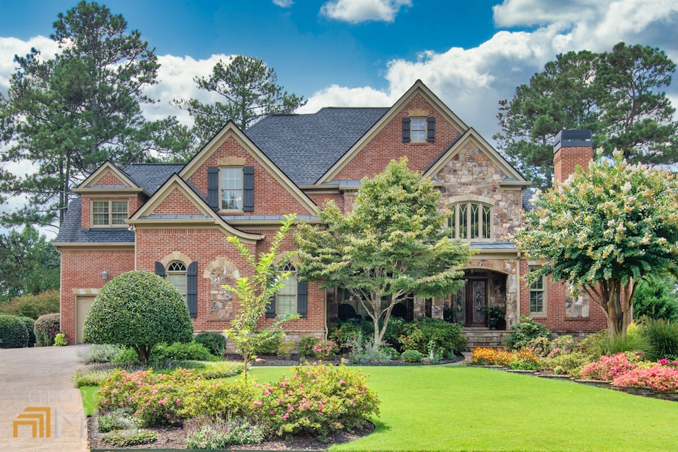 Front of home with immaculately manicured lawn.