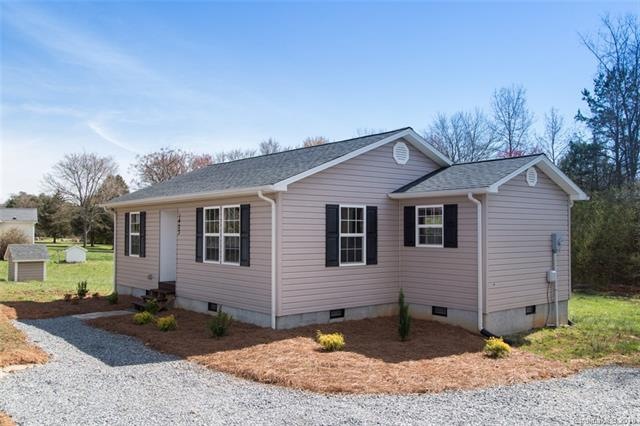 Exterior front view with brand new driveway and landscaping
