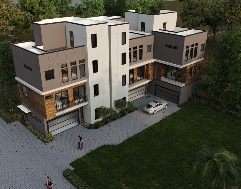 This photo showcases a modern, multi-level home with a sleek design featuring large windows, a mix of wood and gray paneling, and a spacious driveway. It is set in a lush, green environment with surrounding trees, offering a blend of contemporary living and natural beauty. Elevator for easy access to all floors.