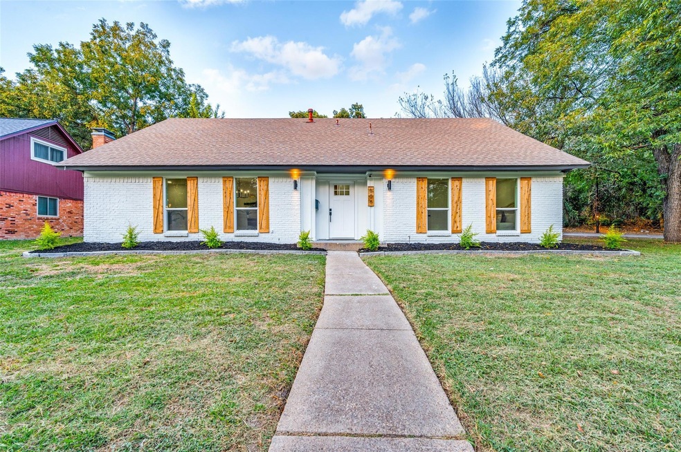 Single story home with a front lawn