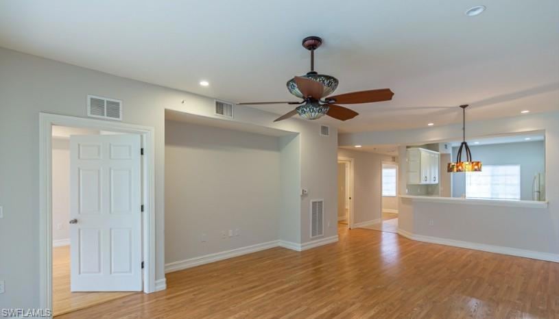 Unfurnished living room with baseboards, recessed 
