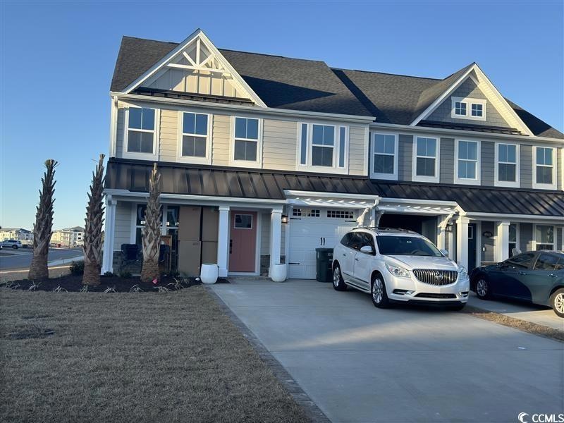 View of front of home featuring a garage