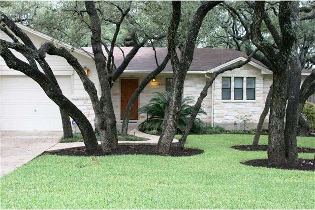 Oak shaded path to front door of custom home