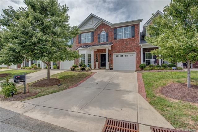 FRONT VIEW home has no structure in front, looks into woods that has walking trail with creek