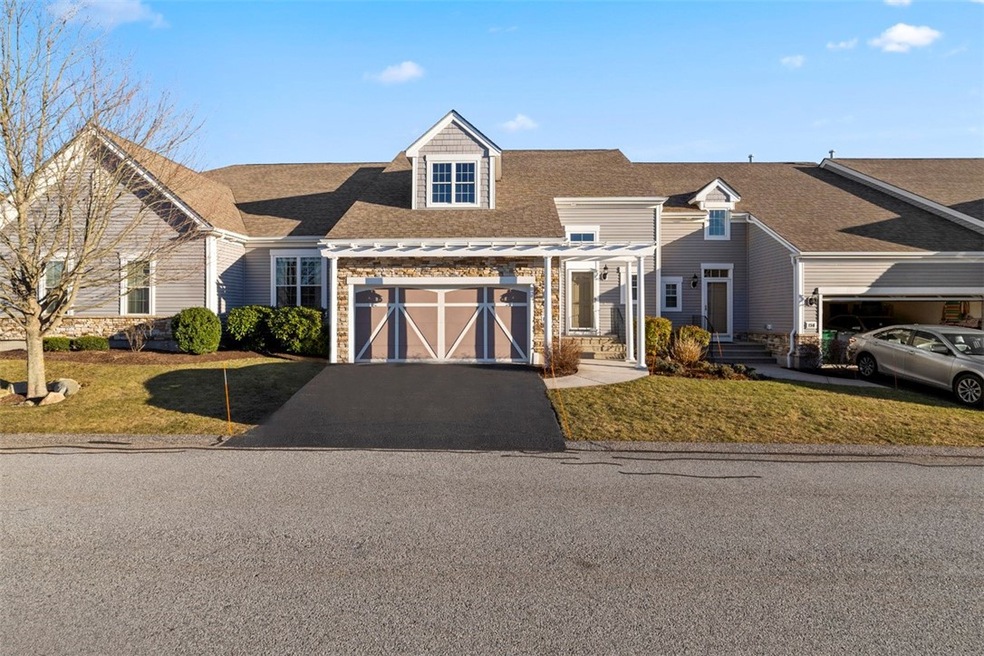 Beautiful curb appeal with pergola over the garage