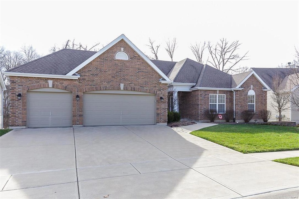 Brick and stone front with architectural roof brin
