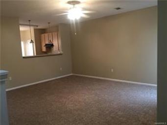 Den area with pass through tot he kitchen