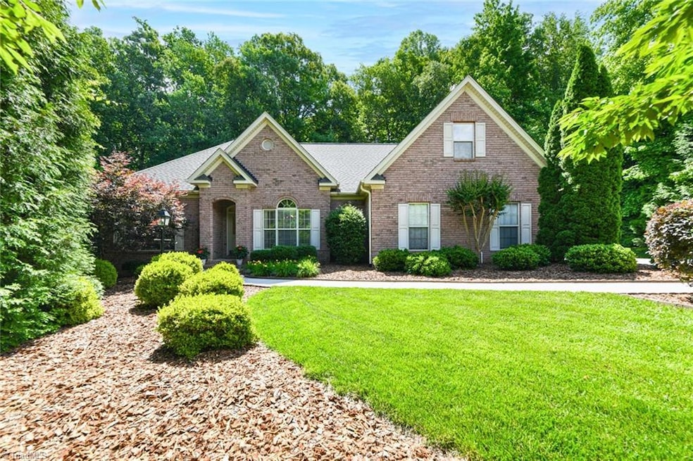 This home greets you with the meticulously manicured lawn with fresh landscaping