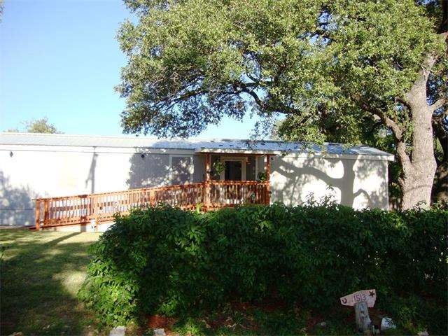 Front yard with Huge Oak tree and many flowering p