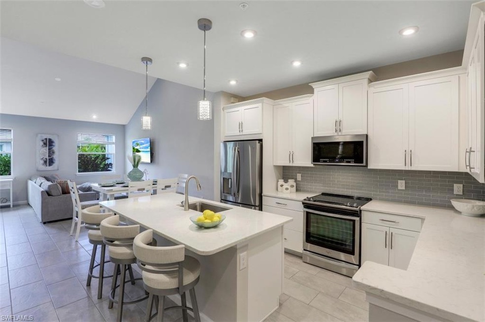 Open Plan Kitchen with Stainless Appliances & Quar
