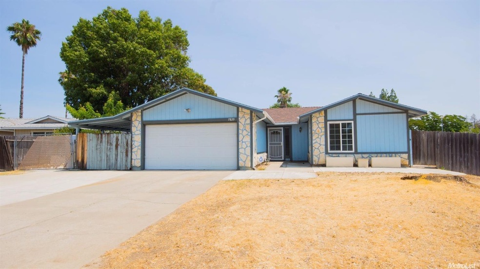 Corner lot with ample parking on driveway, RV access, and front and side streets.