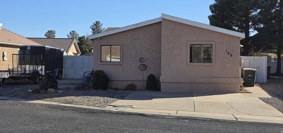 View of front of house featuring stucco siding