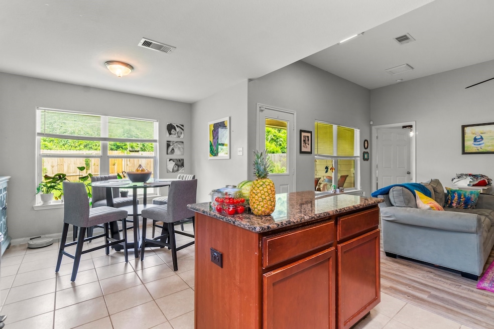 Kitchen open to living room and dining room