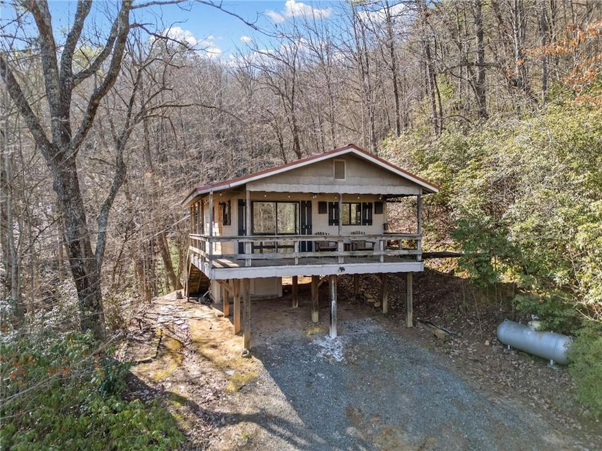 View of front of home featuring a porch and a carp