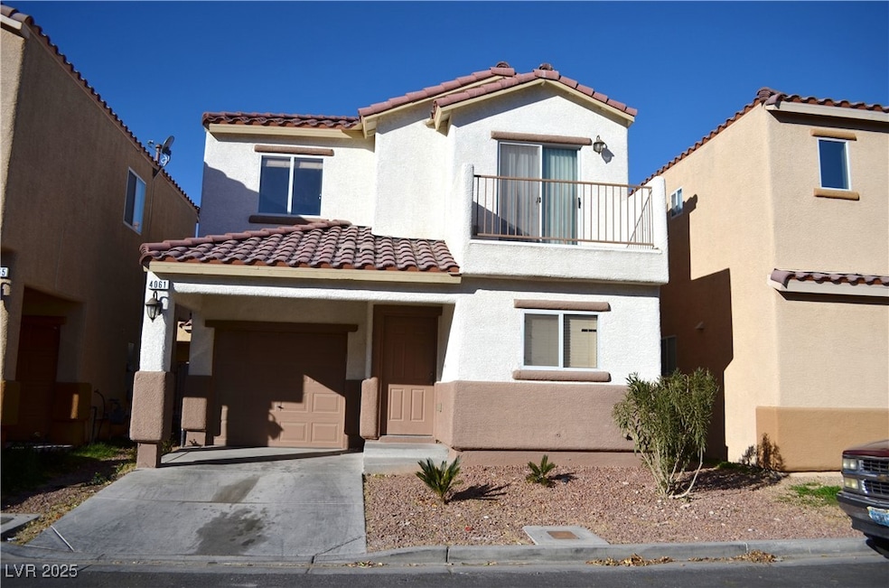 Mediterranean / spanish-style home with a garage,